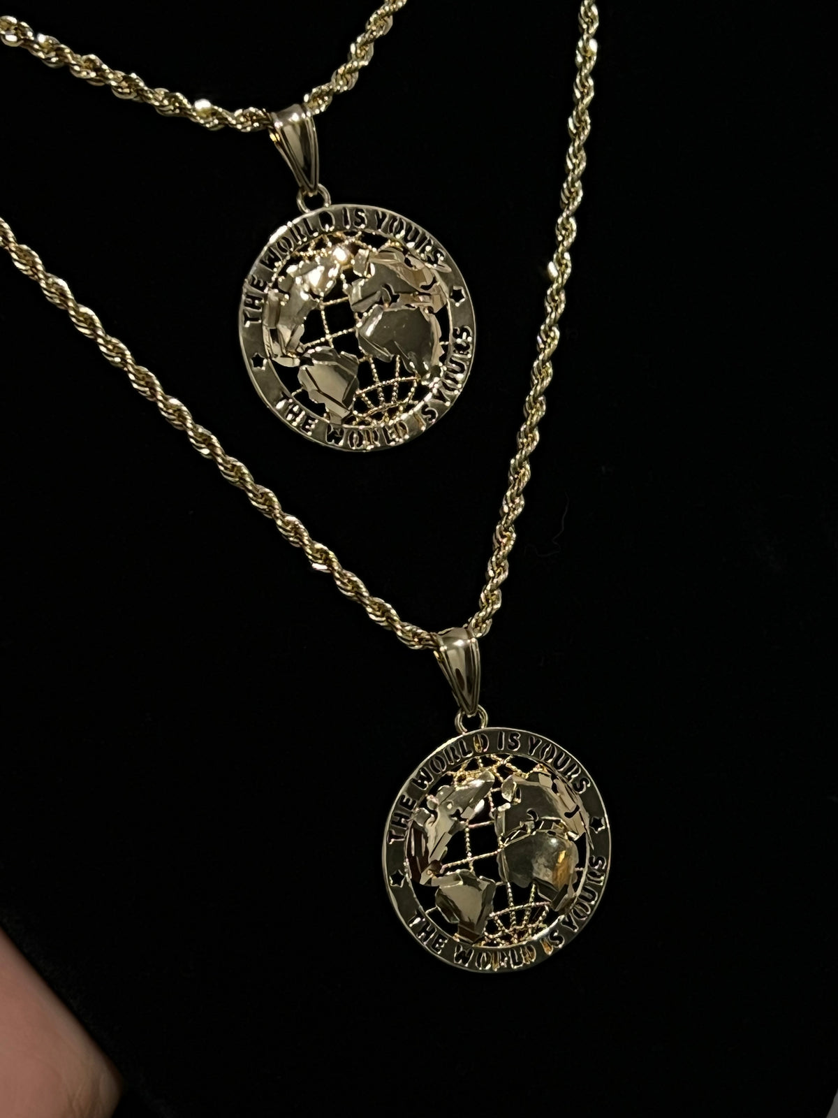 The Wrld is yours pendant necklace